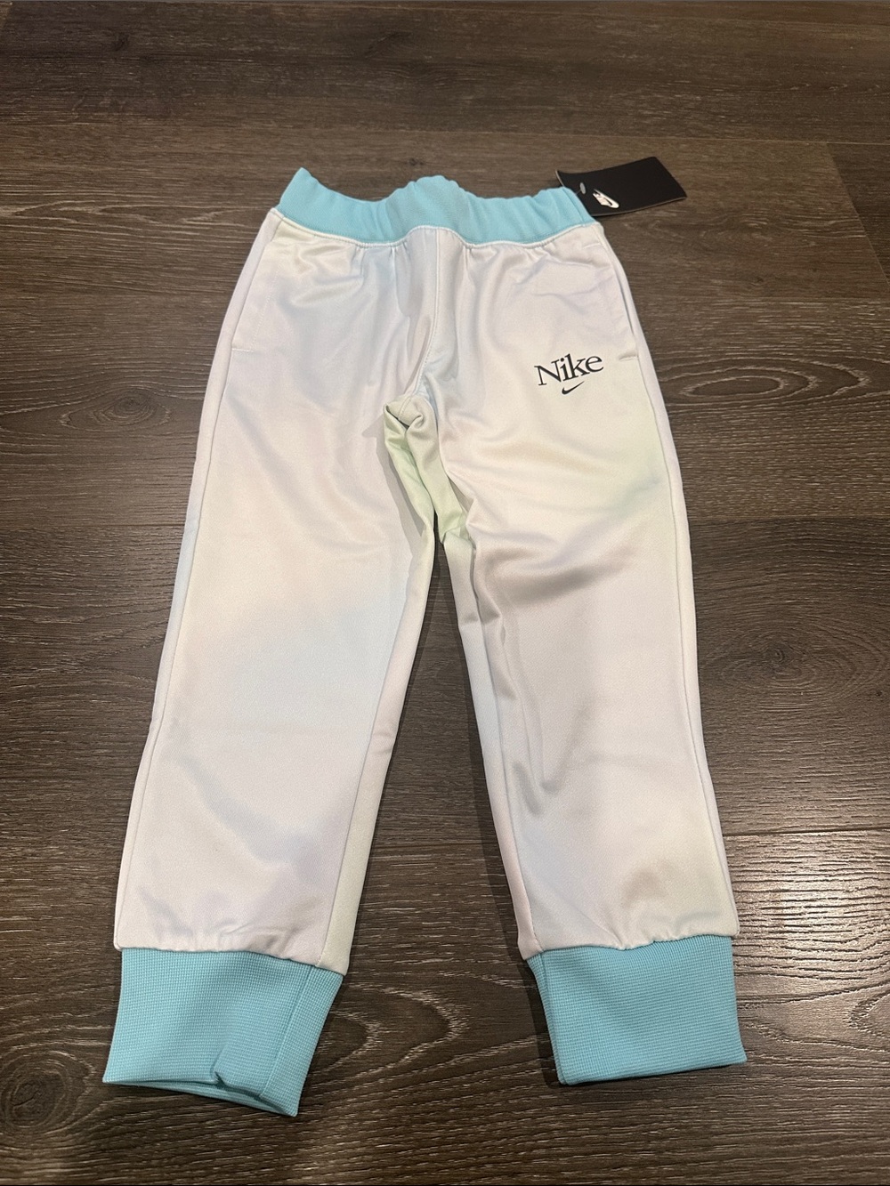 Nike Kids White Sweatpants with Light Blue Waistband and Cuffs